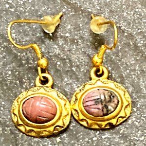 Vintage rhodonite scarab earrings set in golden frames with patina